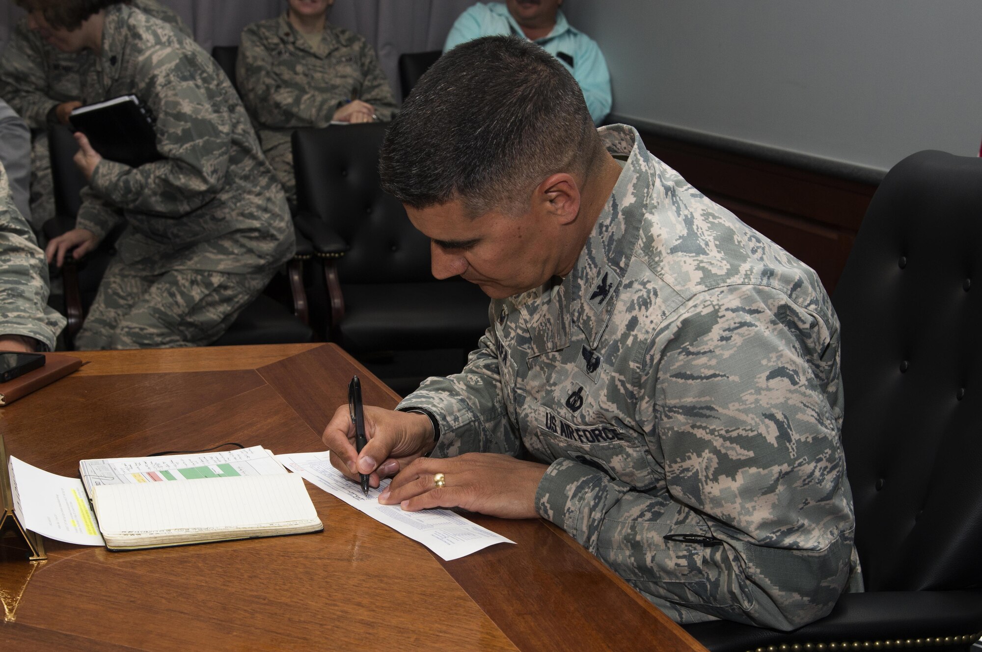 Col. Eric Shafa, 42nd Air Base Wing Commander, fills out an AF 2561 Contribution Form, during the weekly wing staff meeting, April 17, 2017, Maxwell Air Force Base, Ala. Following the meeting, refreshments were offered along with more information about the campaign.To donate, visit 
www.afassistancefund.org. (U.S. Air Force photo/ Senior Airman Alexa Culbert)