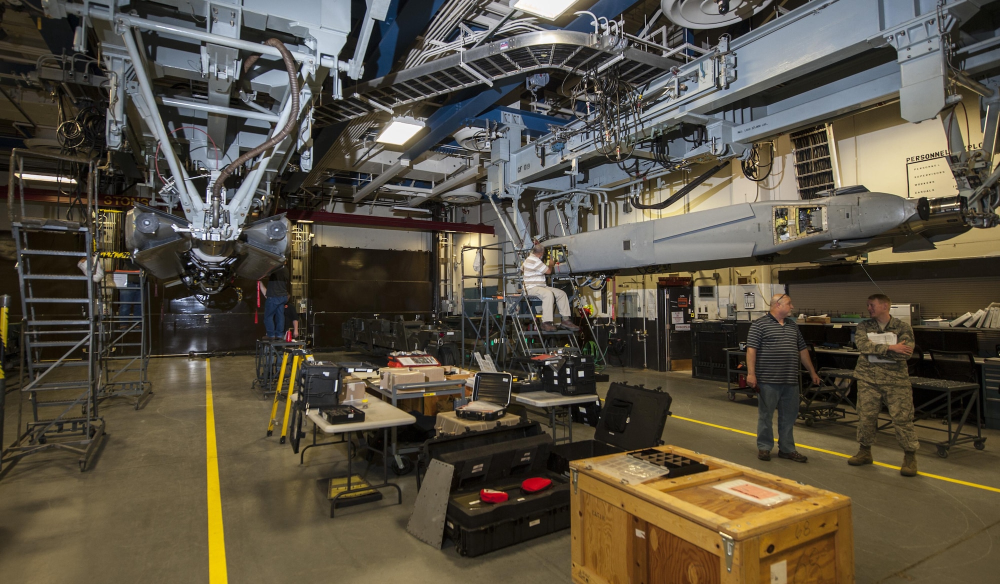 Members of the 49th Test and Evaluation Squadron from Barksdale Air Force Base, La., perform maintenance at Minot AFB, N.D., March 13, 2017. Members of the 49th TES helped the 705th Munitions Squadron evaluate Air Force Global Strike Command’s nuclear-capable cruise missiles and gravity-based weapon systems. (U.S. Air Force photo/Airman 1st Class Jonathan McElderry)