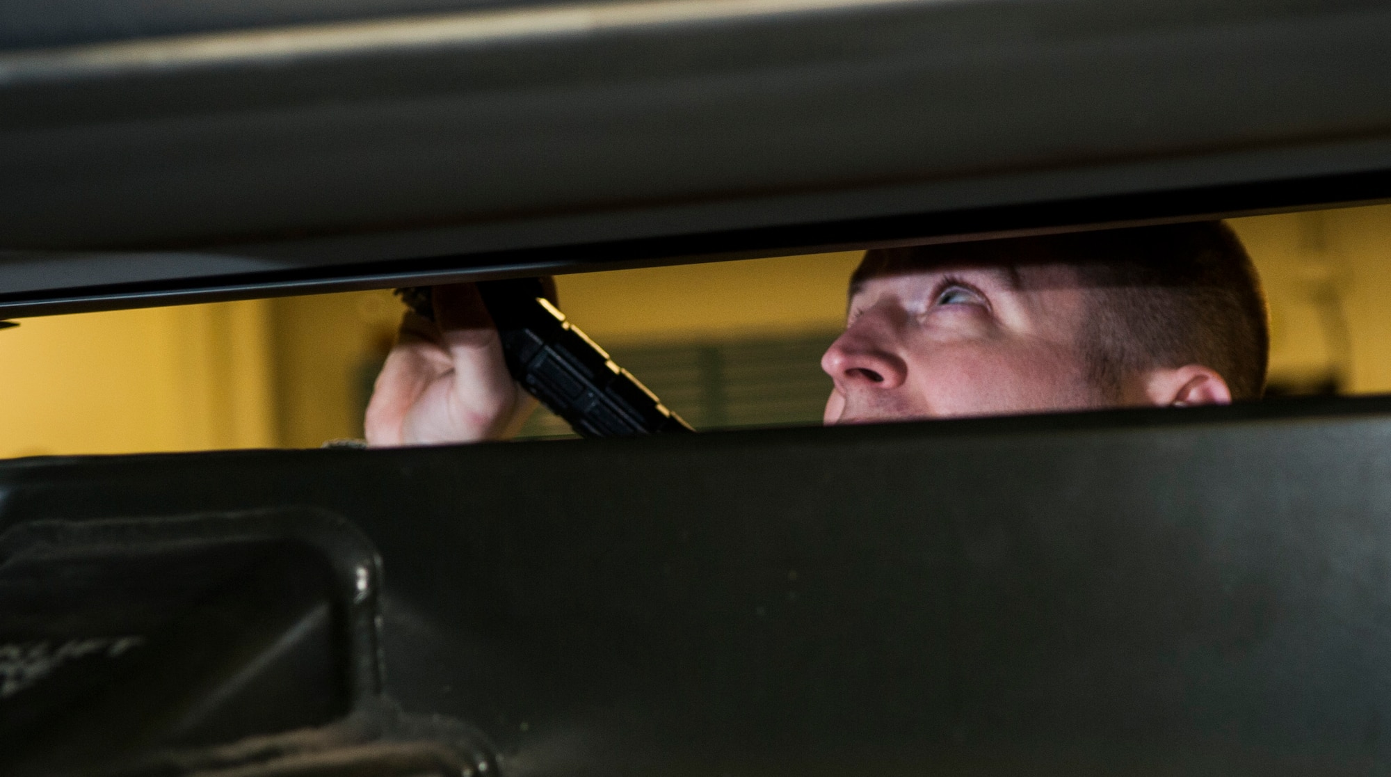 Tech. Sgt. Justin Carpenter, 705th Munitions Squadron nuclear weapons bay chief, inspects a rotary launcher at Minot Air Force Base, N.D., March 13, 2017. Throughout a 12-day process, maintainers are responsible for all scheduled and unscheduled maintenance for missiles, to include engine changes, fueling, testing and storage. (U.S. Air Force photo/Airman 1st Class Jonathan McElderry)