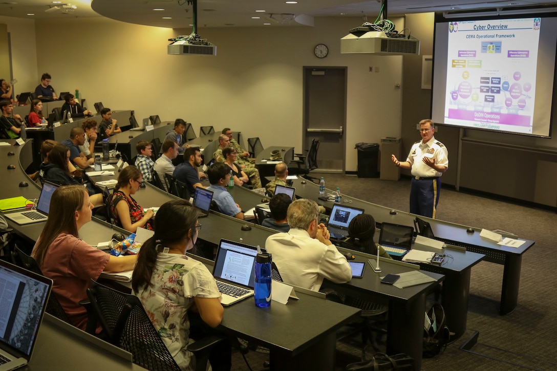 Col. James “Jim” M. Chatfield, cyber director and deputy G-3 of operations for the 335th Signal Command (Theater) speaks to approximately 50 graduate students and Army Reserve Officer Training Corps cadets at the Scheller College of Business at the Georgia Institute of Technology in downtown Atlanta, Georgia April 11.  Chatfield spent about 90 minutes discussing Army cyber capabilities and the future of cyber operations.  (Official U.S. Army Reserve Photo by Sgt. 1st Class Brent C. Powell)