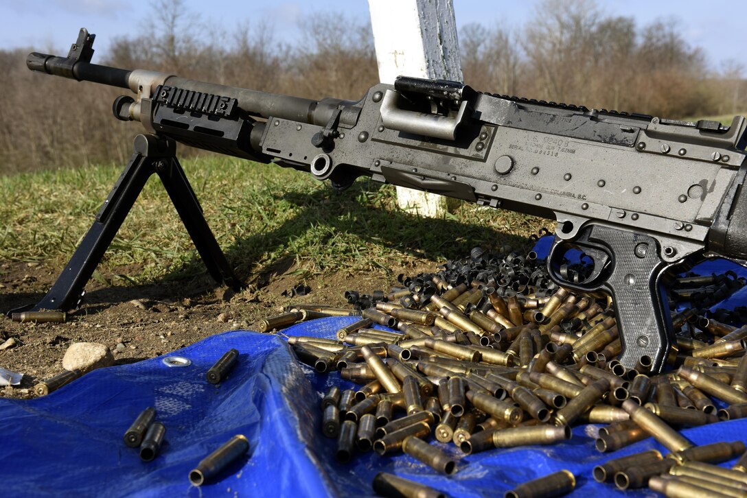 An M-240B machine gun rests on the ground at a crew-served weapons firing range April 12, 2017, at the Fort Custer Training Center in Battle Creek, Michigan. Continuous training keeps Airmen ready to deploy and allows the to be the most lethal choice for the combatant commander, increasing overall force capability. (U.S. Air National Guard photo by Staff Sgt. Shane Hughes)