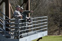 U.S Air Force Col. Kevin Doyle, the wing commander of the 180th Fighter Wing, Ohio Air National Guard, and Lt. Col. John Cupp, the Mission Support Group deputy commander, watch from a platform as their Airmen fire crew-served weapons April 12, 2017, at the Fort Custer Training Center in Battle Creek, Michigan. Continuous training keeps Airmen ready to deploy and allows the to be the most lethal choice for the combatant commander, increasing overall force capability. (U.S. Air National Guard photo by Staff Sgt. Shane Hughes)