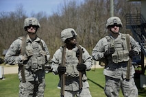U.S. Air Force Senior Airman Nick Ort, Staff Sgt. Jolan Hardiman and Senior Airman Benton Pohlman, security forces personnel assigned to the 180th Fighter Wing, Ohio Air National Guard, wait for their turn to fire a crew-served weapon April 12, 2017 during training at the Fort Custer Training Center in Battle Creek, Michigan. Frequent training events allow Airmen to prepare for deployments, ensuring they are fit to fight. (U.S. Air National Guard photo by Staff Sgt. Shane Hughes)
