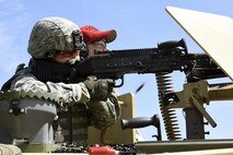 U.S. Air Force Capt. Diana Sluhan, a security forces offficer assigned to the 180th Fighter Wing, Ohio Air National Guard, fires a crew-served weapon mounted atop a humvee April 12, 2017 during training at the Fort Custer Training Center in Battle Creek, Michigan. Frequent training events allow Airmen to prepare for deployments, ensuring they are fit to fight. (U.S. Air National Guard photo by Staff Sgt. Shane Hughes)