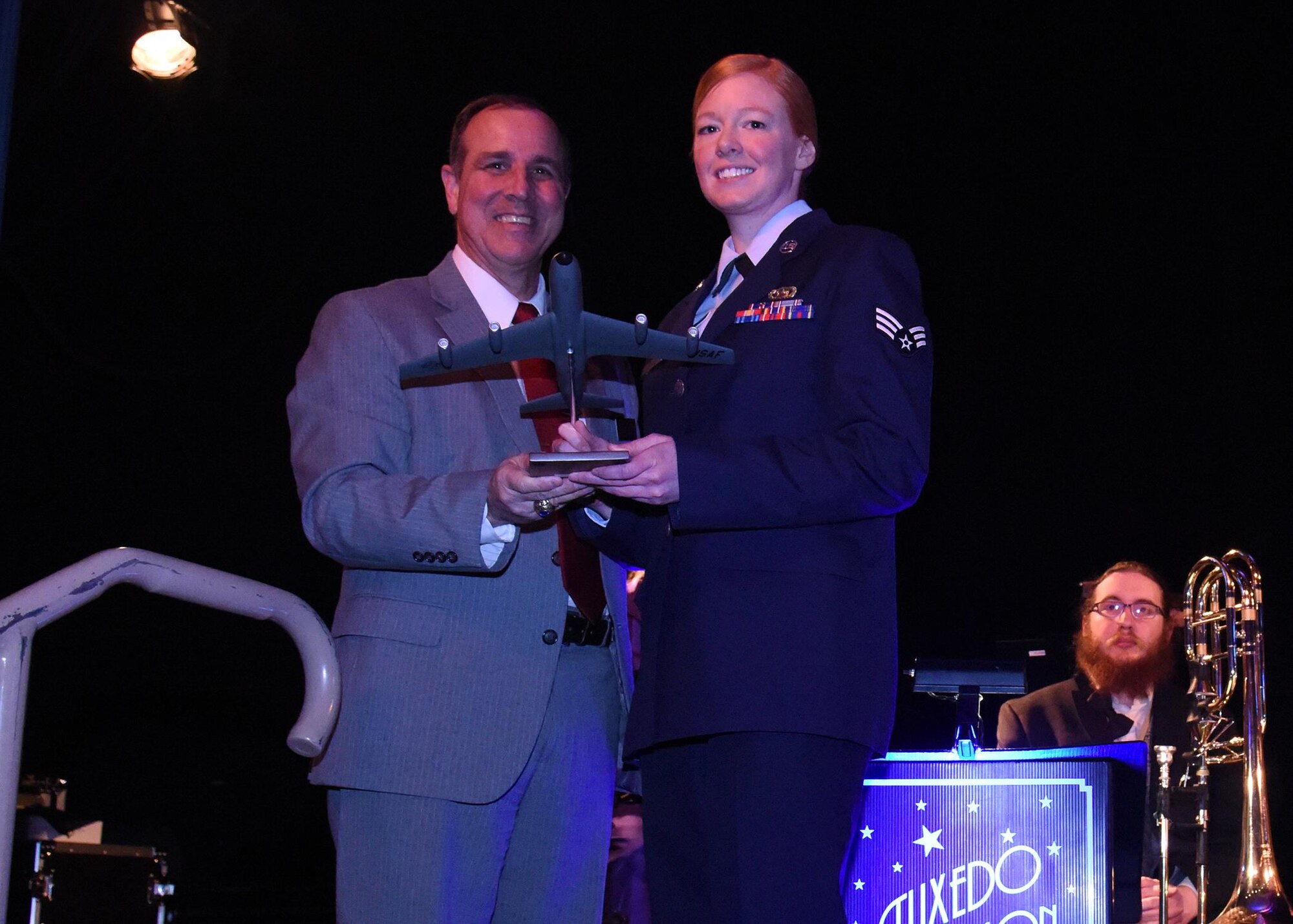 Senior Airman Amber Craig, 92nd Operations Support Squadron intelligence trainer, receives the Junior Enlisted of the Year Award from the West Plains Chamber of Commerce at the Best of the West Awards Gala April 14 in Airway Heights, Wash. The event recognized outstanding contributions to the local community. (U.S. Air Force photo/Staff Sgt. Samantha Krolikowski)