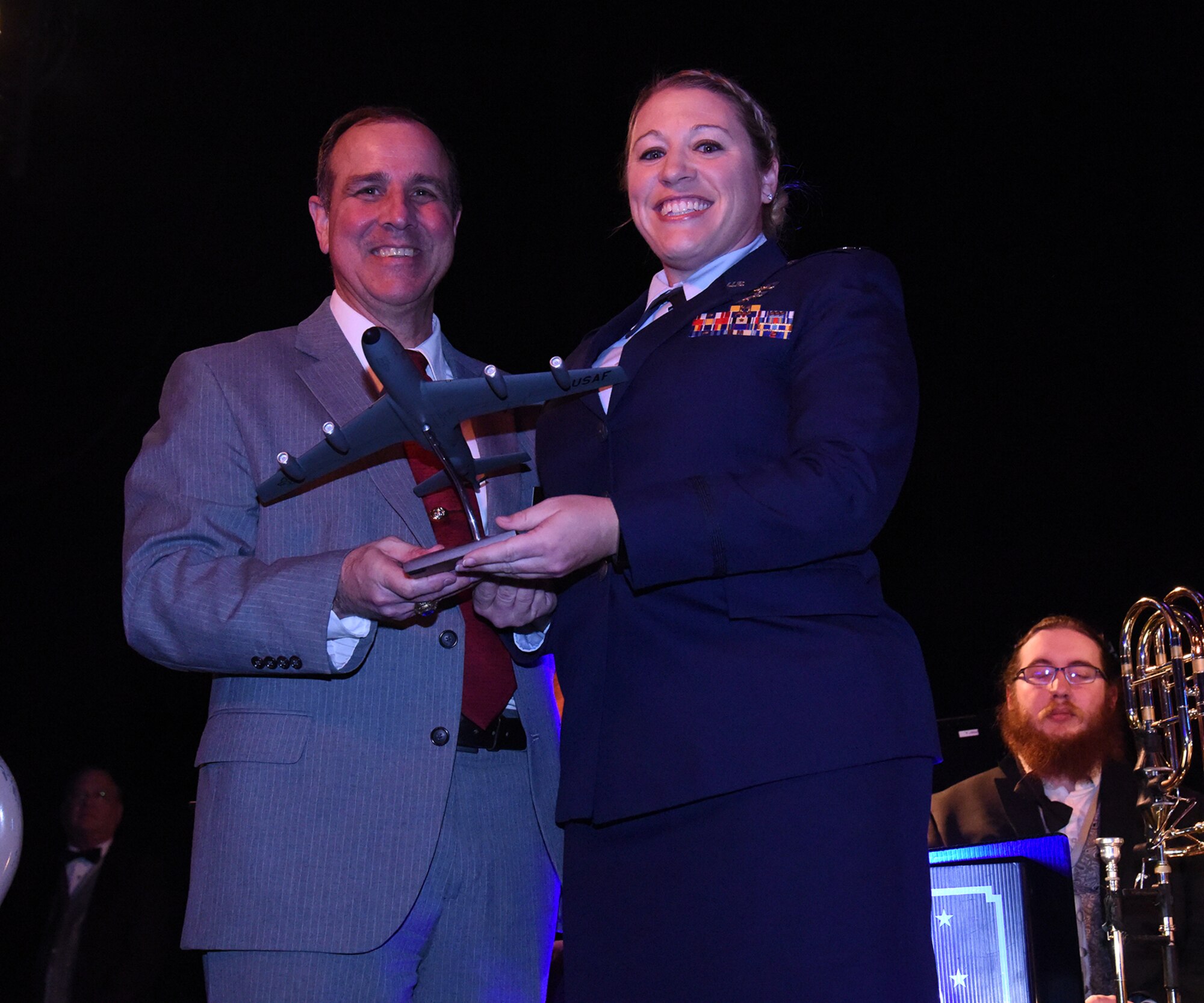 Capt. Robin Voigt, 141st Logistics Readiness Squadron distribution and deployment flight commander, receives the Company Grade Officer of the Year Award from the West Plains Chamber of Commerce at the Best of the West Awards Gala April 14 in Airway Heights, Wash. The event recognized outstanding contributions to the local community. (U.S. Air Force photo/Staff Sgt. Samantha Krolikowski)