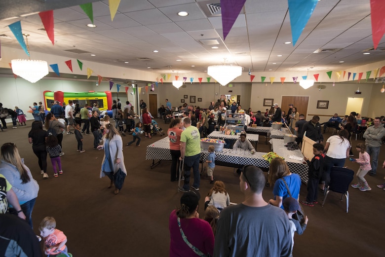 Mighty Ninety families participate in the activities during the Spring Fling Carnival at F.E. Warren Air Force Base, Wyo., April 15, 2017. The Spring Fling Carnival was open to all military families with base access. The 90th Force Support Squadron held the event for the local community to mark the start of spring and bring families together for a fun event. (U.S. Air Force photo by Staff Sgt. Christopher Ruano)