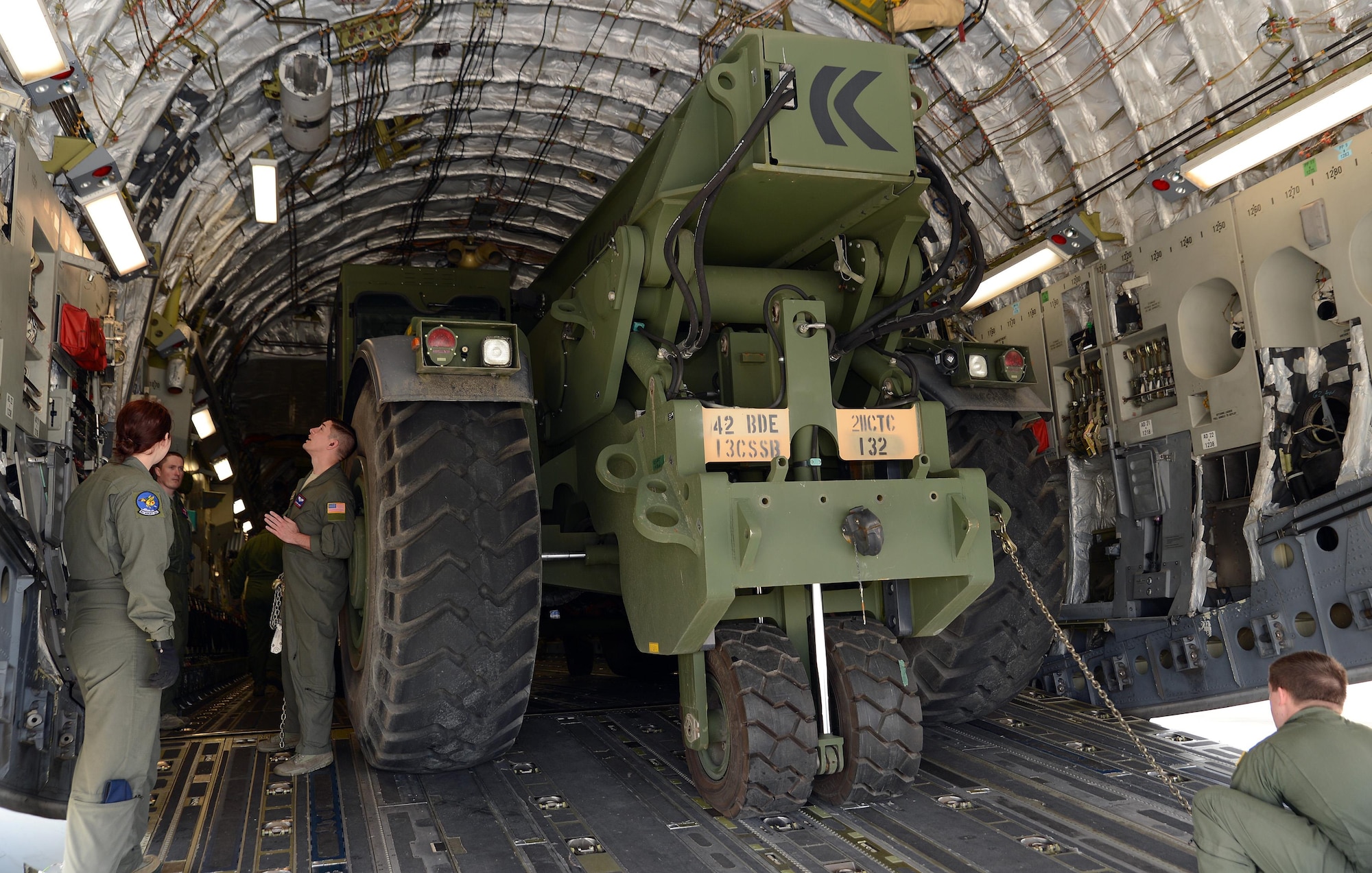 Team McChord loadmasters load a Rough Terrain Container Handler in a C-17 Globemaster III April 13, 2017, during a Mission Oriented Training exercise at Joint Base Lewis-McChord, Wash. The exercise provided beneficial training to loadmasters and allowed them to practice training Soldiers on the proper loading of the C-17. (U.S. Air Force photo/Senior Airman Jacob Jimenez)   