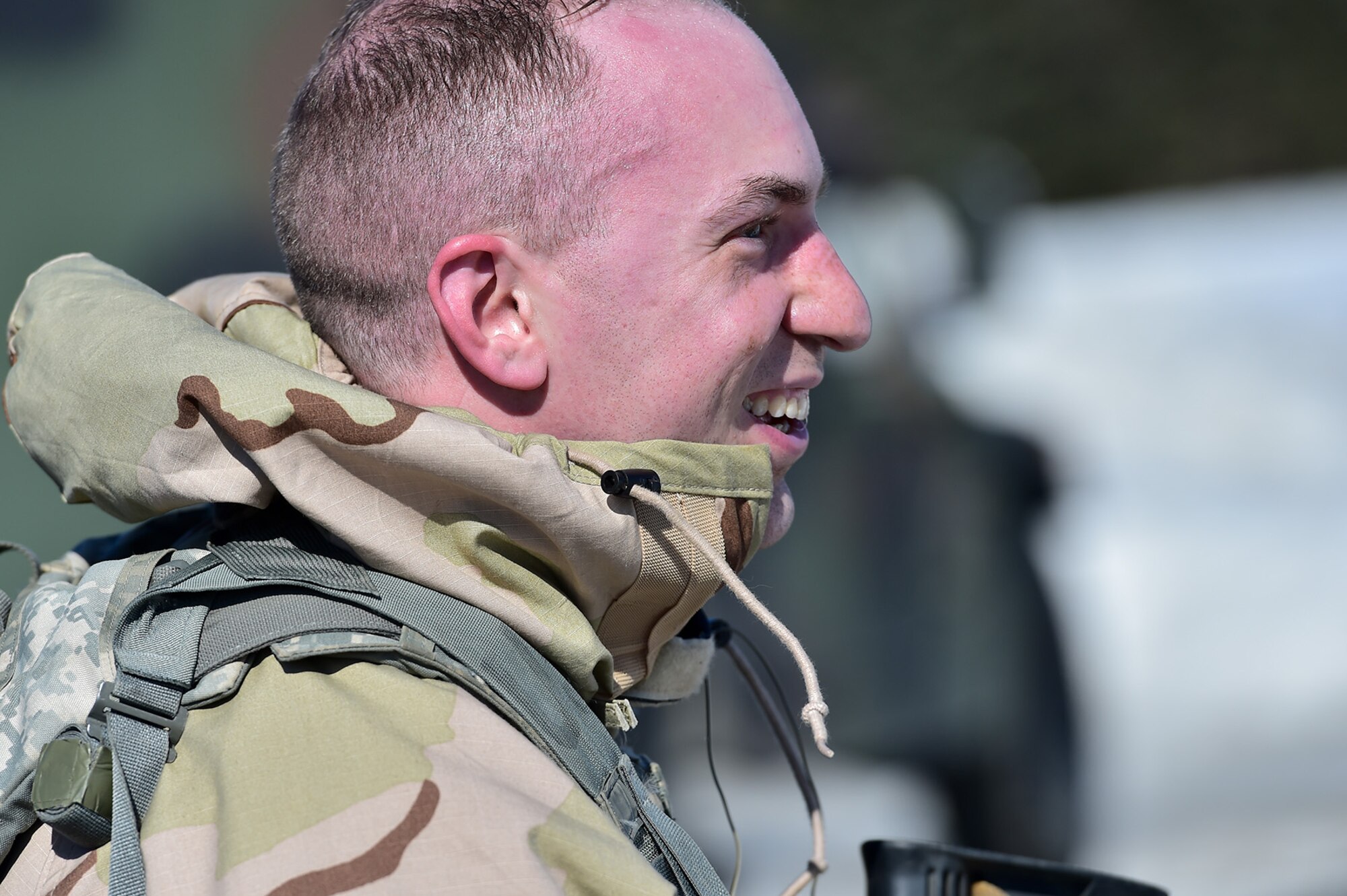 Spc. Michael Forlife, assigned to the 95th Chemical Company, “Arctic Dragons”, 17th Combat Sustainment Support Battalion, U.S. Army Alaska, smiles when he takes off his protective mask after a Joint Service Lightweight Integrated Suit Technology stress fire at McGee range on Joint Base Elmendorf-Richardson, Alaska, April 13, 2017. The JSLIST is the product of a four-Service effort to field a common chemical protective clothing ensemble including a lightweight protective garment, multi-purpose overboots and gloves. 