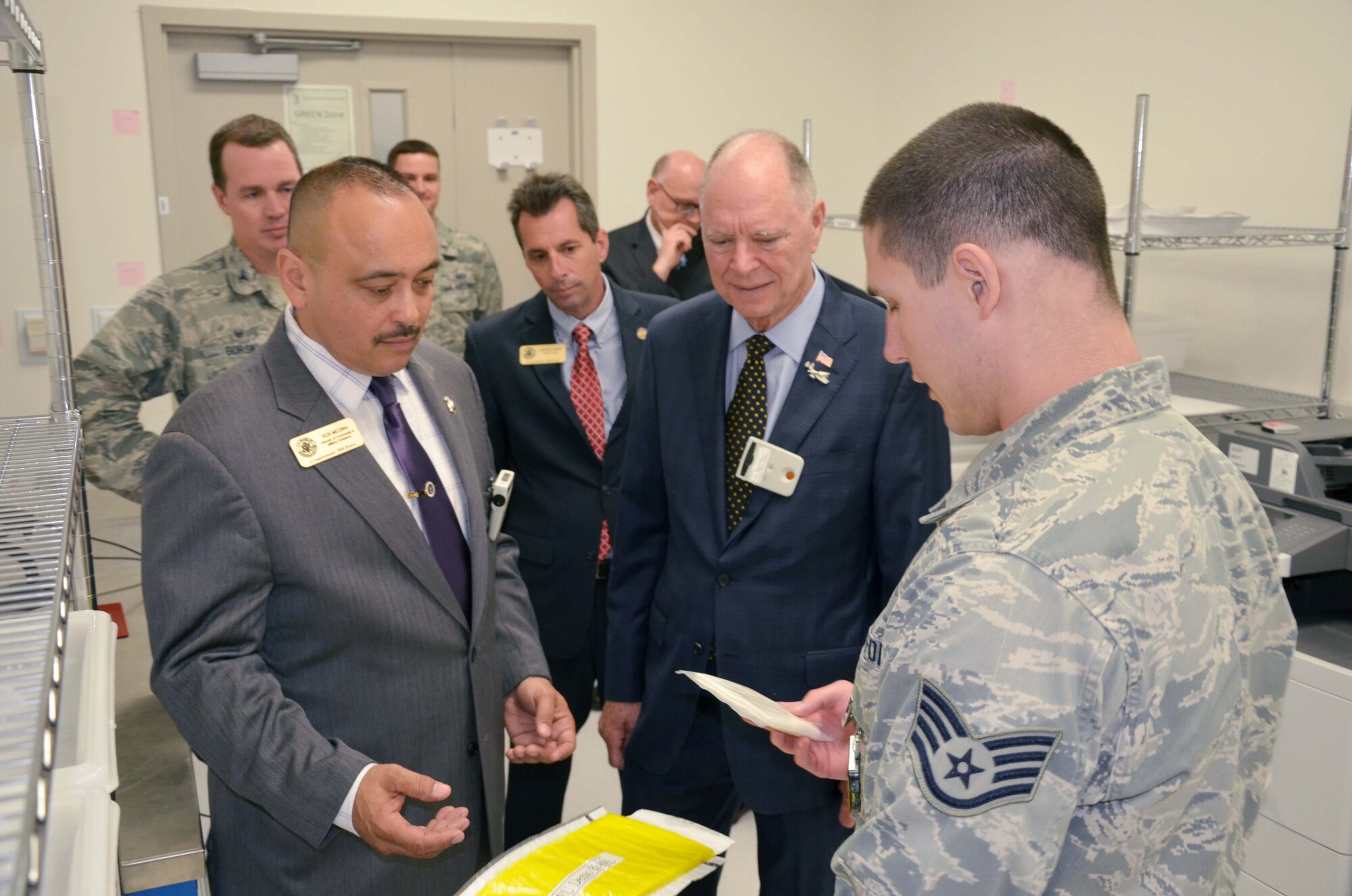 Staff Sgt. Nathan Korytko (right), a nuclear measurements technician with the Air Force Technical Applications Center, Patrick AFB, Fla., shows various types of filter media to U.S. Rep. Bill Posey (center) from Florida’s 8th Congressional District, Posey’s District Director Patrick Gavin and Director of Community Relations Rob Medina.  Posey and members of his staff visited the nuclear treaty monitoring center for a mission update April 11, 2017. (U.S. Air Force photo by Susan A. Romano)