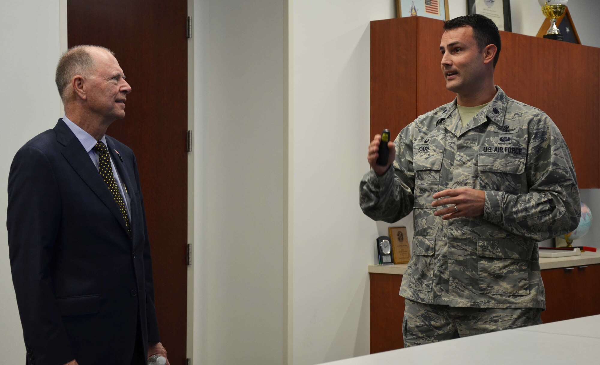 Lt. Col. Ehren Carl, commander of the Technical Surveillance Squadron, Air Force Technical Applications Center, Patrick AFB, Fla., briefs U.S. Rep. Bill Posey from Florida’s 8th Congressional District about his squadron’s involvement in detecting underground disturbances in the vicinity of North Korea’s reported nuclear tests in January and September 2016.  Posey and members of his staff visited the nuclear treating monitoring center April 11, 2017 for a mission update. (U.S. Air Force photo by Susan A. Romano)
