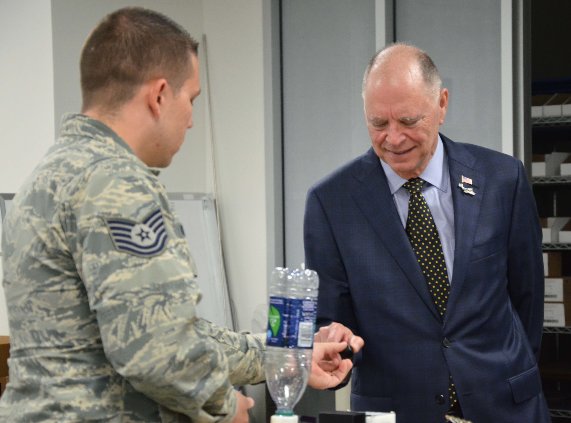 Tech. Sgt. Donald E. Kramer II, a technician assigned to the Air Force Technical Applications Center, Patrick AFB, Fla., describes a recent innovation he developed in AFTAC’s Innovation Lab to U.S. Rep. Bill Posey of Florida’s 8th Congressional District during the congressman’s visit to the nuclear treaty monitoring center April 11, 2017. (U.S. Air Force photo by Susan A. Romano)