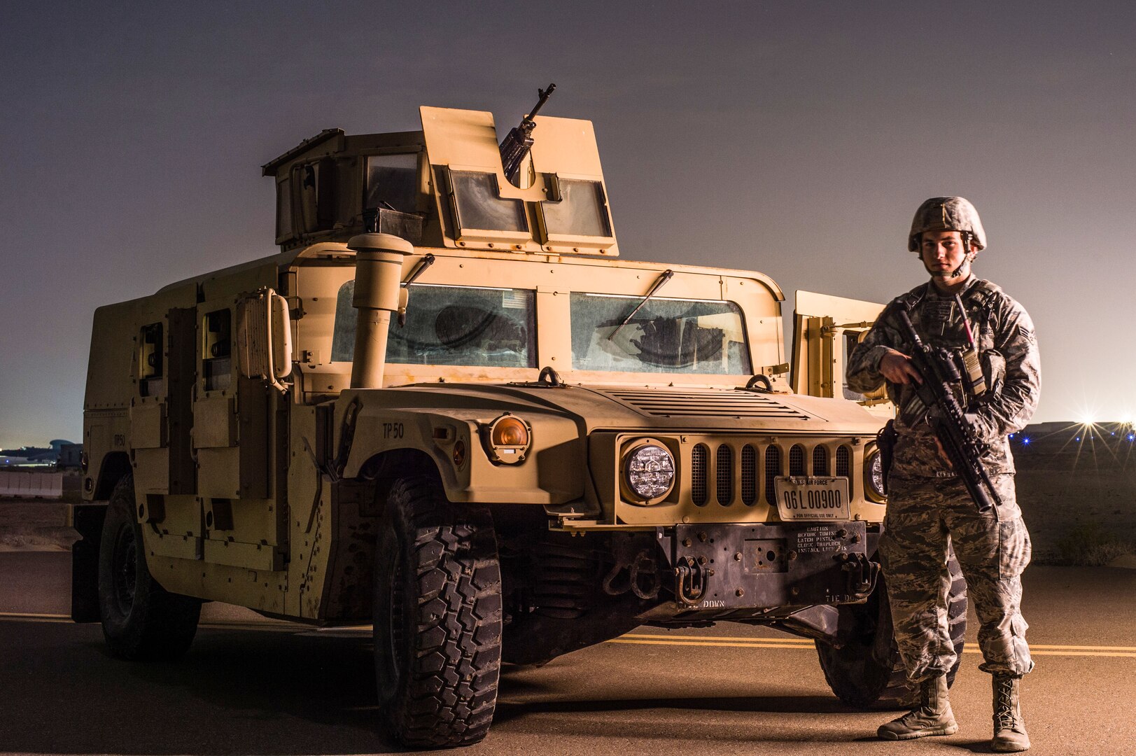 A member of the 380th Expeditionary Security Forces Squadron poses for a photo while guarding a U-2 Dragonlady at an undisclosed location in Southwest Asia, Feb. 8, 2017. Security forces members directly contribute to the area of responsibility by defending critical mission assets which are working to weaken and destroy Islamic State in Iraq and the Levant operations in the Middle East region and around the world. (U.S. Air Force photo/Senior Airman Tyler Woodward)