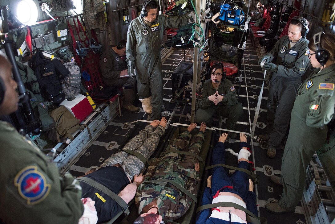 Airmen from the 137th Aeromedical Evacuation Squadron, Oklahoma Air National Guard; 142 AES, Delaware ANG; 146 AES, California ANG; and 183 AES, Mississippi ANG, discuss simulated patient care during the Multiple Aircraft Training Opportunity Program (MATOP) organized by the 137th Aeromedical Evacuation Squadron from Will Rogers Air National Guard Base, Oklahoma City, April 7, 2017. Airmen of the 137 AES were joined by eight of the nine Air National Guard aeromedical evacuation squadrons as they hosted the annual training event and accomplished mandatory annual aeromedical training requirements. (U.S. Air National Guard photo by Senior Master Sgt. Andrew M. LaMoreaux/Released)