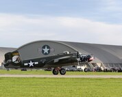 The B-25 Mitchell bomber Betty’s Dream lands on a runway next to the National Museum of the U.S. Air Force at Wright-Patterson Air Force Base, Ohio, April 17, 2017. The Betty’s Dream, out of Houston, Texas, is one of the 11 World War II bombers taking part in the museum’s celebration of the 75th anniversary of the Doolittle Raid when Army Air Corps bombers took off from an aircraft carrier to deliver the first strike of the war on the Japanese homeland. (U.S. Air Force photo by R.J. Oriez)