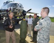 Larry Kelly talks with Staff Sgt. Andrew Wanros, 175th Wing Maryland Air National Guard, in front of Kelly’s B-25 Mitchell Bomber on a runway by the National Museum of the U.S. Air Force at Wright-Patterson Air Force Base, Ohio, April 17, 2017. Wanros traveled to Wright-Patterson AFB to take part in the museum’s celebration of the 75th anniversary of the Doolittle Raid when Army Air Corps bombers took off from an aircraft carrier to deliver the first strike of the war on the Japanese homeland. (U.S. Air Force photo by R.J. Oriez)