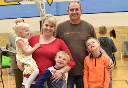 U.S. Army Staff Sgt. Mikki Munson, a human resources specialist with the Wyoming Army National Guard’s Joint Force Headquarters, along with husband Jason, pose for a photo with their children Lily, Jaxson and Hunter, during the 2017 Month of the Military Child Kick-Off Party at Storey Gym in Cheyenne, April 6. Governor Matt Mead signed a proclamation noting the important and challenging role of military children and officially proclaimed April 2017 as the Month of the Military Child in Wyoming. 