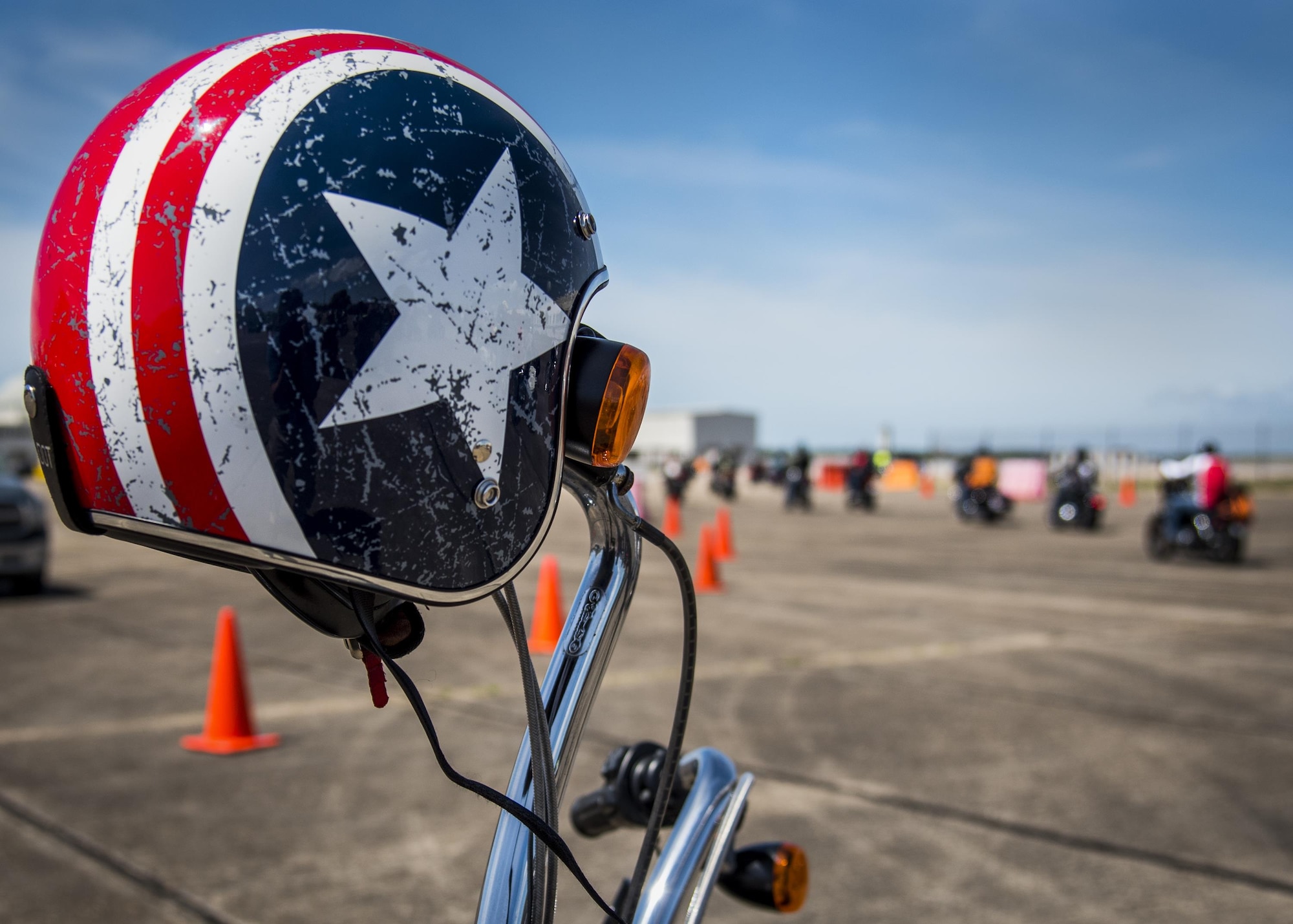 A bike and helmet wait for their rider as people roll out after the annual motorcycle safety rally at Eglin Air Force Base, Fla., April 14.  More than 500 motorcyclists came out for the event that meets the annual safety briefing requirement for base riders.  (U.S. Air Force photo/Samuel King Jr.)