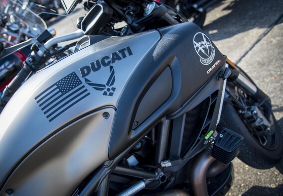 A bike adorned with the Air Force symbol sits in front of the hangar during the annual motorcycle safety rally at Eglin Air Force Base, Fla., April 14.  More than 500 motorcyclists came out for the event that meets the annual safety briefing requirement for base riders.  (U.S. Air Force photo/Samuel King Jr.)
