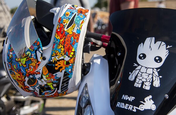 A highly detailed helmet sits on a bike in front of the hangar during the annual motorcycle safety rally at Eglin Air Force Base, Fla., April 14.  More than 500 motorcyclists came out for the event that meets the annual safety briefing requirement for base riders.  (U.S. Air Force photo/Samuel King Jr.)
