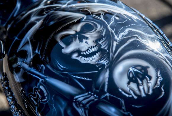A “Sons of Anarchy” painted bike sits in front of the hangar during the annual motorcycle safety rally at Eglin Air Force Base, Fla., April 14.  More than 500 motorcyclists came out for the event that meets the annual safety briefing requirement for base riders.  (U.S. Air Force photo/Samuel King Jr.)