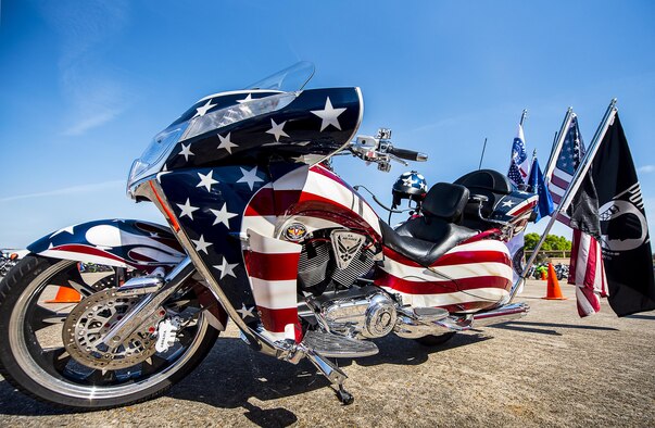 A red, white and blue painted bike sits in front of the hangar during the annual motorcycle safety rally at Eglin Air Force Base, Fla., April 14.  More than 500 motorcyclists came out for the event that meets the annual safety briefing requirement for base riders.  (U.S. Air Force photo/Samuel King Jr.)