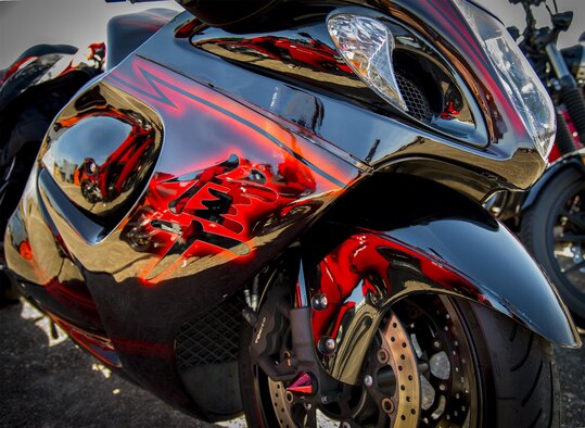 A highly-detailed paint job appears on a bike sitting in front of the hangar during the annual motorcycle safety rally at Eglin Air Force Base, Fla., April 14.  More than 500 motorcyclists came out for the event that meets the annual safety briefing requirement for base riders.  (U.S. Air Force photo/Samuel King Jr.)