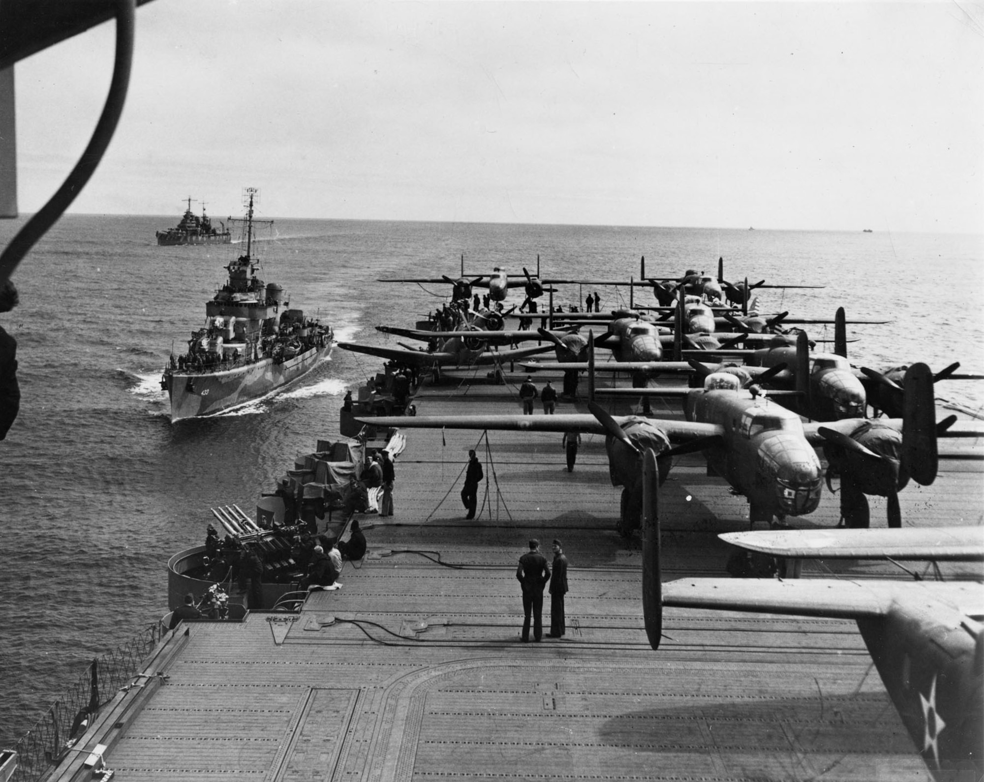 Most of the 16 B-25 medium bombers on the back half of the USS Hornet somewhere in the Pacific in April 1942.  Capt. Marc Mitscher, the commander of the Hornet, managed to load 16 of the Army Air Force bombers on the carrier’s flight deck.  (US Navy official photo)