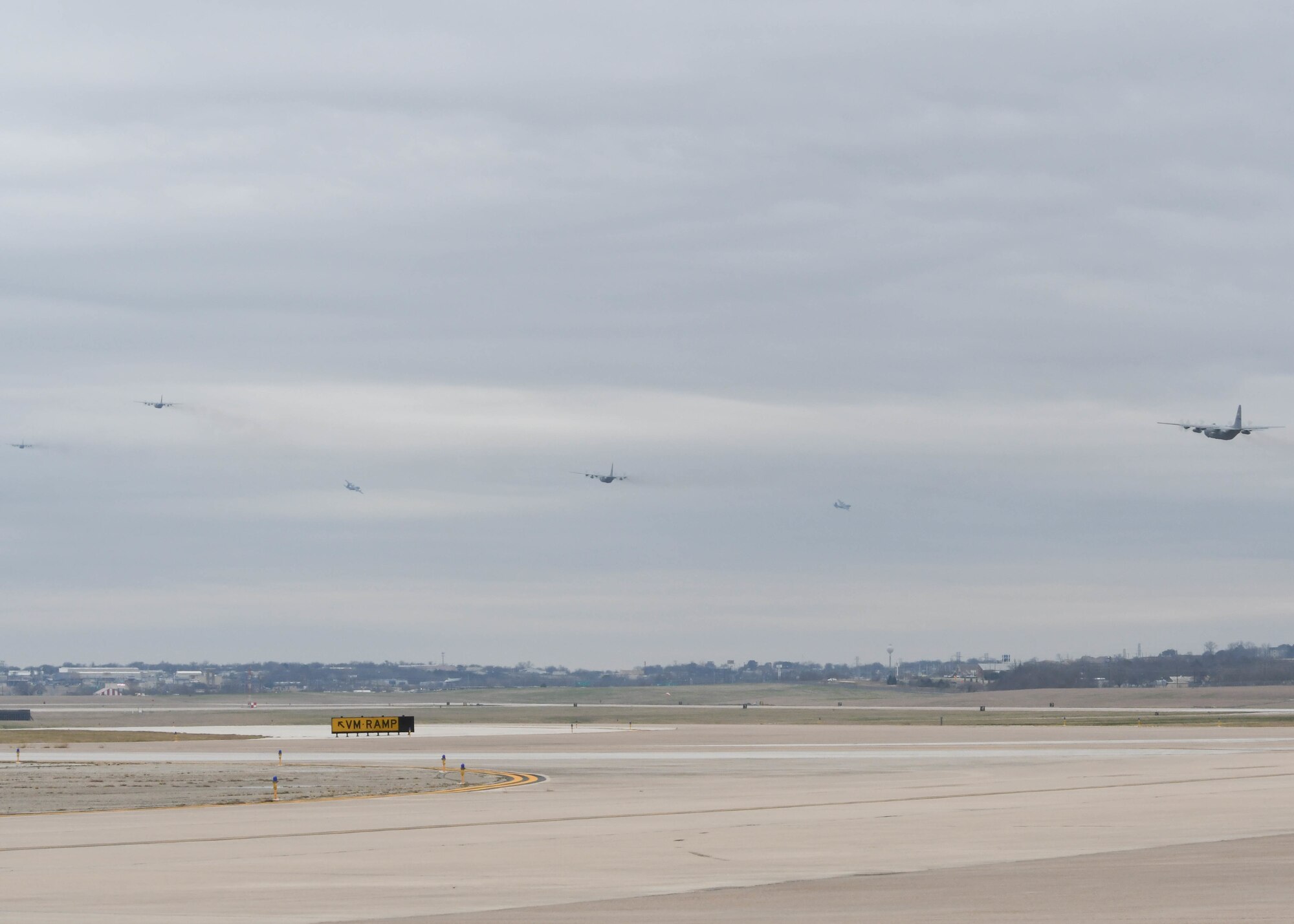 Six C-130H2 Hercules aircraft with the 136th Airlift Wing, Texas Air National Guard, take off from Naval Air Station Fort Worth Joint Reserve Base, Texas, Feb. 26, 2017. The flight was part of a max-fly effort that was done using the wing’s traditional guard force. (Air Force photo by Senior Airman De'Jon Williams)