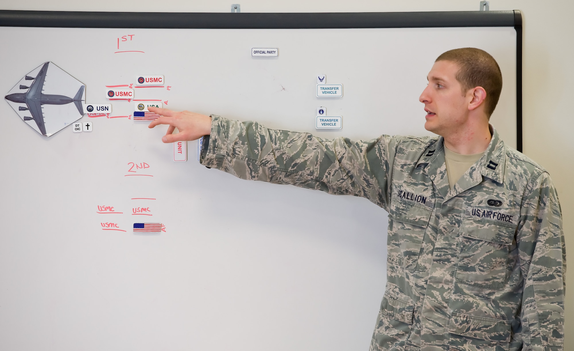 Capt. Brian Scallion, Air Force Mortuary Affairs Operations, dignified transfer officer in charge, briefs the transfer sequence to Folded Flag 2017 carry teams April 11, 2017, on Dover Air Force Base, Del. AFMAO held a joint service training exercise that tested its ability to respond to a mass casualty incident. (U.S. Air Force photo by Roland Balik)