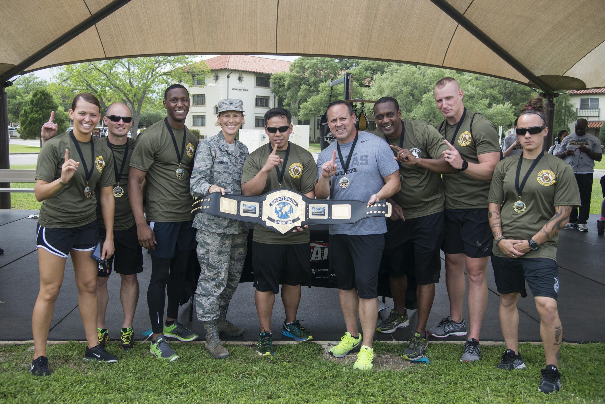 The 902nd Security Forces Squadron “Survivor’s Challenge” team posses with Brig. Gen. Heather Pringle, 502nd Air Base Wing and Joint Base San Antonio commander, after winning first place during the competition April 13, 2017, at Joint Base San Antonio-Randolph. Survivor’s Challenge is a JBSA competition where teams compete in mental and physical challenges to help raise awareness and prevent sexual assault within the military and federal service.  (U.S. Air Force photo by Sean M. Worrell)