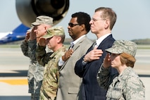 Col. Dawn Lancaster, Air Force Mortuary Affairs Operations commander, renders a salute to a simulated fallen service member’s transfer case passingby the official party April 11, 2017, on Dover Air Force Base, Del. AFMAO held Folded Flag 2017, a joint service training exercise that tested its ability to respond to a mass casualty incident. (U.S. Air Force photo by Roland Balik)
