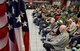 Korean War veterans who are residents of the State of Oklahoma Veterans Home, Norman, Oklahoma, are framed by the American flag as they listen to remarks given by Lt. Gen. Lee K. Levy II, Air Force Sustainment Center commander, as he recognizes their service March 30, 2017. Many of the veterans are wearing donated commemorative shirts honoring them. (U.S. Air Force photo/Greg L. Davis)
