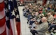 Korean War veterans who are residents of the State of Oklahoma Veterans Home, Norman, Oklahoma, are framed by the American flag as they listen to remarks given by Lt. Gen. Lee K. Levy II, Air Force Sustainment Center commander, as he recognizes their service March 30, 2017. Many of the veterans are wearing donated commemorative shirts honoring them. (U.S. Air Force photo/Greg L. Davis)