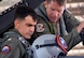 NAVAL AIR STATION FORT WORTH JOINT RESERVE BASE, Texas -- Capt. Mike Steffen, base commander, listens as Lt. Col. Brett Comer, 301st Operations Group commander and F-16 Fighting Falcon pilot, offers instructions in preparation for flight, April 14, 2017. Steffen received the flight in a 301st Fighter Wing demonstration of Air Force Reserve combat operations and capabilities.(U.S. Air Force photo by Staff Sgt. Samantha Mathison)