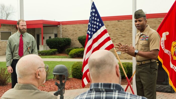 Col. Ricardo Player (center), the Force Headquarters Group chief of staff, Marine Forces Reserve, speaks to the family of Cpl. Nathan Bryson (left), a Marine Corps veteran who most recently served as a motor transport operator for Headquarters and Support Battalion, School of Infantry East, Camp Lejeune, North Carolina, after he was awarded the Navy and Marine Corps Medal in Brook Park, Ohio, April 13, 2017. Bryson was awarded the medal for his actions in 2014 when he and a fellow Marine saved a man from a burning vehicle. The medal is considered the highest medal one can achieve outside of combat and is often times given for daring and selfless acts that put a person in harm’s way. (U.S. Marine Corps Photo by Cpl. Dallas Johnson/Released)