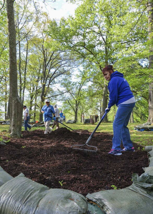 Volunteers rake mulch at a Civil War earthworks site on Fort Eustis during Earth Week events at Joint Base Langley-Eustis, Va., April 17, 2017. The 733rd Civil Engineer Division organized mulching, sandbagging and spreading grass seed at this site to help prevent further erosion. (U.S. Air Force photo/Tech. Sgt. Katie Gar Ward)