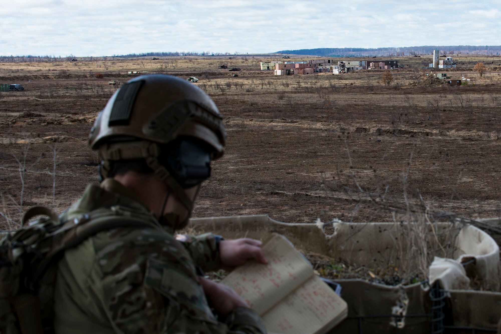 U.S. Air Force Senior Airman Evan Conde, 19th Air Support Operations Squadron Tactical Air Control Party specialist, radios in an air strike during a joint close air support exercise, April 12, 2017, at Camp Grayling, Mich. To further build interoperability and hone their unique skillset, members of the German air force Air Ground Operations Squadron travelled to the U.S. to partner with the 19th ASOS and conduct a close air support exercise working with A-10C Thunderbolts IIs and F-16 Fighting Falcons. (U.S. Air Force photo by Airman 1st Class Daniel Snider)