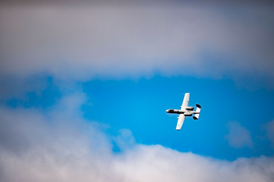 An A-10C Thunderbolt II flies above Camp Grayling, Mich. during a joint close air support exercise, April 12, 2017. To further build interoperability and hone their unique skillset, members of the German air force Air Ground Operations Squadron travelled to the U.S. to partner with the 19th Air Support Operations Squadron and conduct a close air support exercise working with A-10C Thunderbolts IIs and F-16 Fighting Falcons. (U.S. Air Force photo by Airman 1st Class Daniel Snider)
