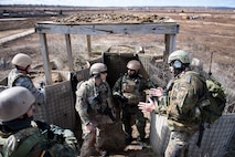Airmen from the 19th Air Support Operations Squadron and the German air force discuss close air support procedures during an exercise, April 12, 2017, at Camp Grayling, Mich. To further build interoperability and hone their unique skillset, members of the German air force Air Ground Operations Squadron travelled to the U.S. to partner with the 19th ASOS and conduct a close air support exercise working with A-10C Thunderbolts IIs and F-16 Fighting Falcons. (U.S. Air Force photo by Airman 1st Class Daniel Snider)