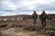 U.S. Air Force Senior Airman Evan Conde, 19th Air Support Operations Squadron Tactical Air Support Party specialist, and German air force Maj. Nader Samadi, Air Ground Operations Squadron commander, travel to their next destination while Conde communicates with local aircraft during a close air support exercise, April 12, 2017, at Camp Grayling, Mich. To further build interoperability and hone their unique skillset, members of the German air force Air Ground Operations Squadron travelled to the U.S. to partner with the 19th ASOS and conduct a close air support exercise working with A-10C Thunderbolts IIs and F-16 Fighting Falcons. (U.S. Air Force photo by Airman 1st Class Daniel Snider)