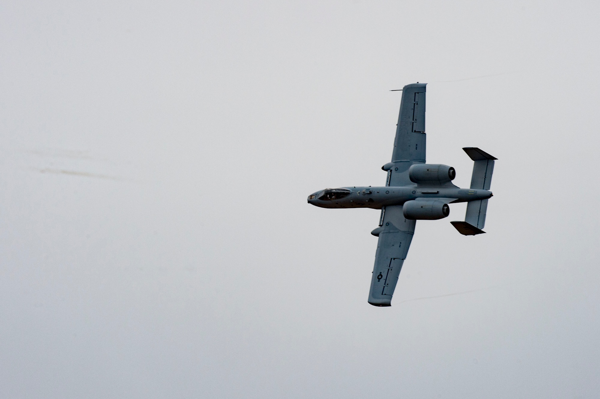 An A-10C Thunderbolt II flies above Camp Grayling, Mich., during a joint close air support exercise, April 13, 2017. To further build interoperability and hone their unique skillset, members of the German air force Air Ground Operations Squadron travelled to the U.S. to partner with the 19th Air Support Operations Squadron and conduct a close air support exercise working with A-10C Thunderbolts IIs and F-16 Fighting Falcons. (U.S. Air Force photo by Airman 1st Class Daniel Snider)