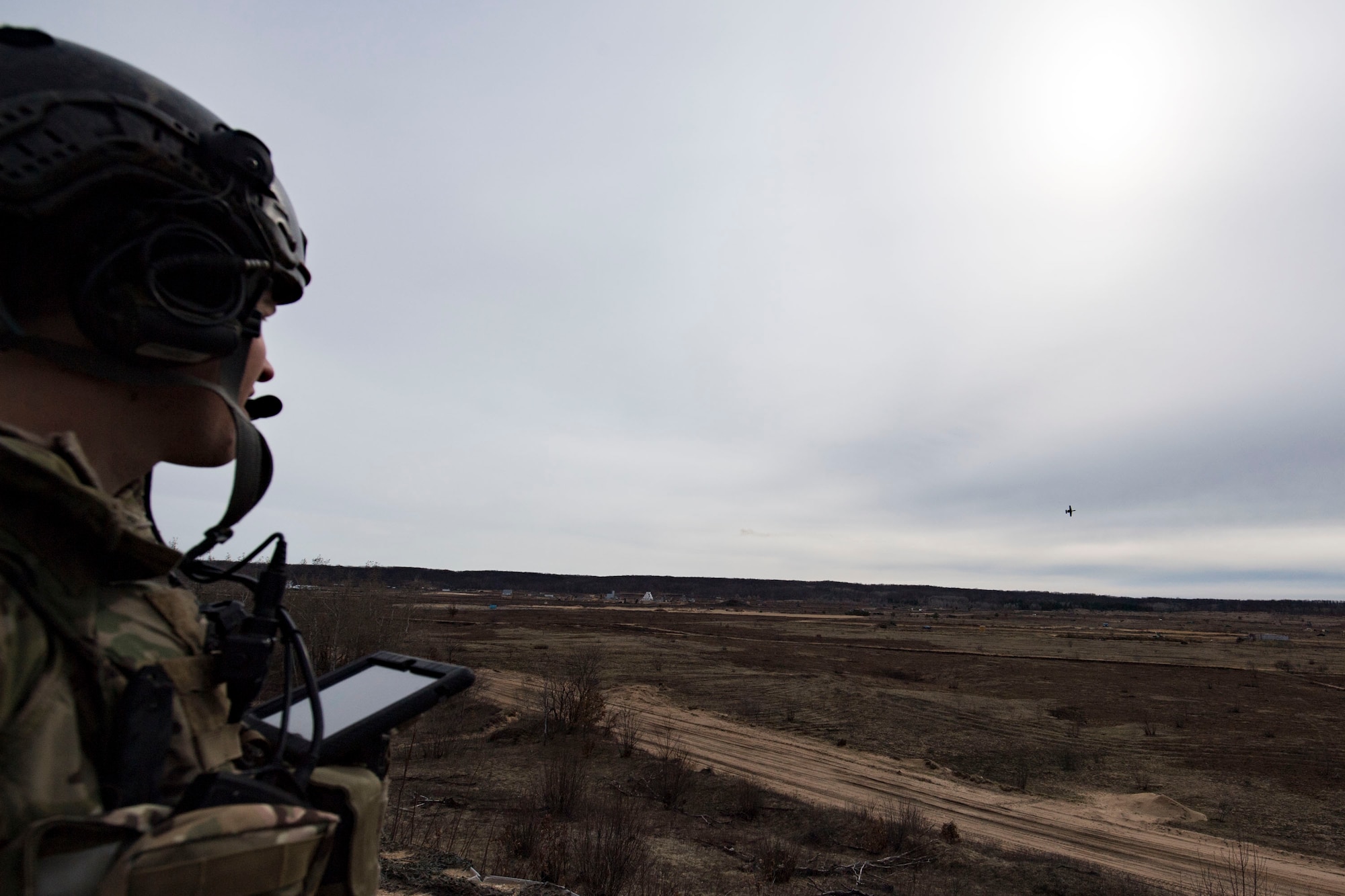 U.S. Air Force Senior Airman Tyler Marketon, 19th Air Support Operations Squadron Tactical Air Control Party specialist, watches as an A-10C Thunderbolt II attacks simulated targets during a close air support exercise, April 13, 2017, at Camp Grayling, Mich. To further build interoperability and hone their unique skillset, members of the German air force Air Ground Operations Squadron travelled to the U.S. to partner with the 19th ASOS and conduct a close air support exercise working with A-10C Thunderbolts IIs and F-16 Fighting Falcons. (U.S. Air Force photo by Airman 1st Class Daniel Snider)