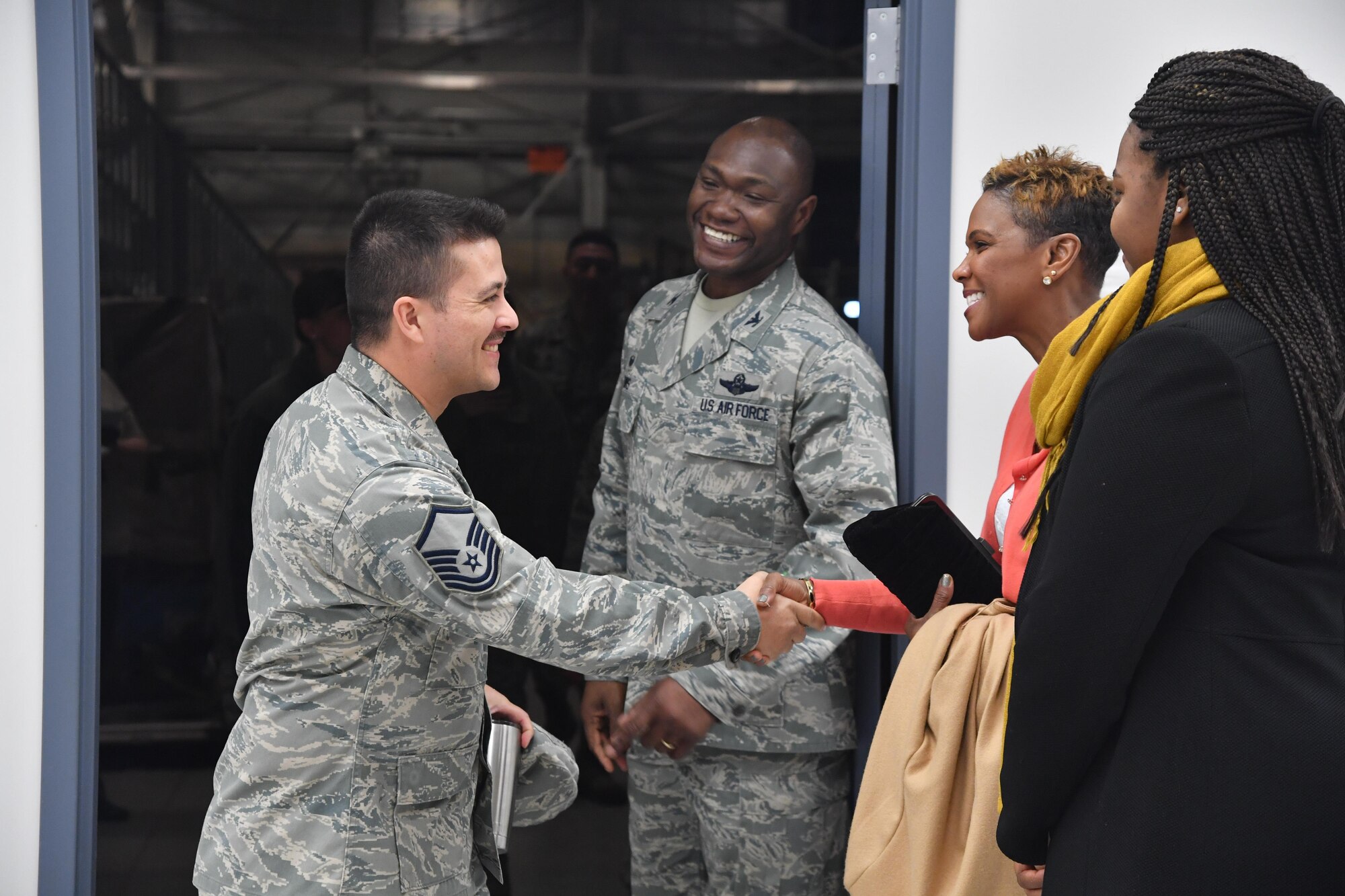 Col. Rodney Lewis, 319th Air Base Wing commander, and his family say goodbye to Airmen after his final all call as the base commander on Grand Forks Air Force Base, N.D., April 14, 2017. Lewis and his family left Grand Forks AFB for the Pentagon as Lewis takes the position of director of the executive action group for the Air Force Chief of Staff. (U.S. Air Force photo by Airman 1st Class Elijaih Tiggs)