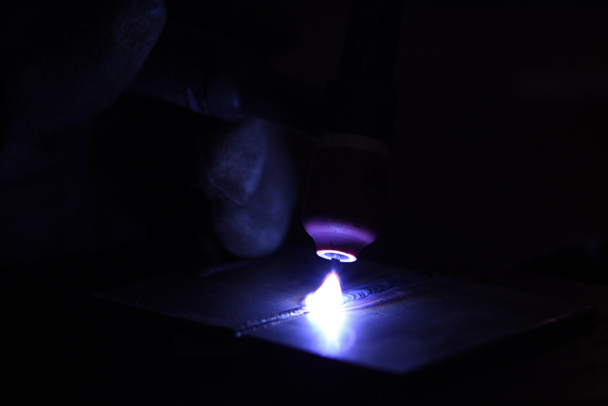 Welding machines produce fire at more than 2,000 degrees Fahrenheit to change the structural integrity of the aircraft components so they don’t have to be replaced. (U.S. Air Force photo by Airman 1st Class Kevin Sommer Giron)