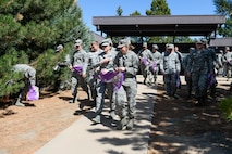 Airmen begin their search for 12 golden eggs among 1,400 eggs hidden during the 2nd Annual Easter Egg Hunt at Schriever Air Force Base, Colorado, Wednesday, April 12, 2017. The 50th Space Wing Chaplains Office hosted the event as a way to allow Airmen to enjoy candy, prizes and the feeling of childhood again.  (U.S. Air Force photo/Christopher DeWitt)