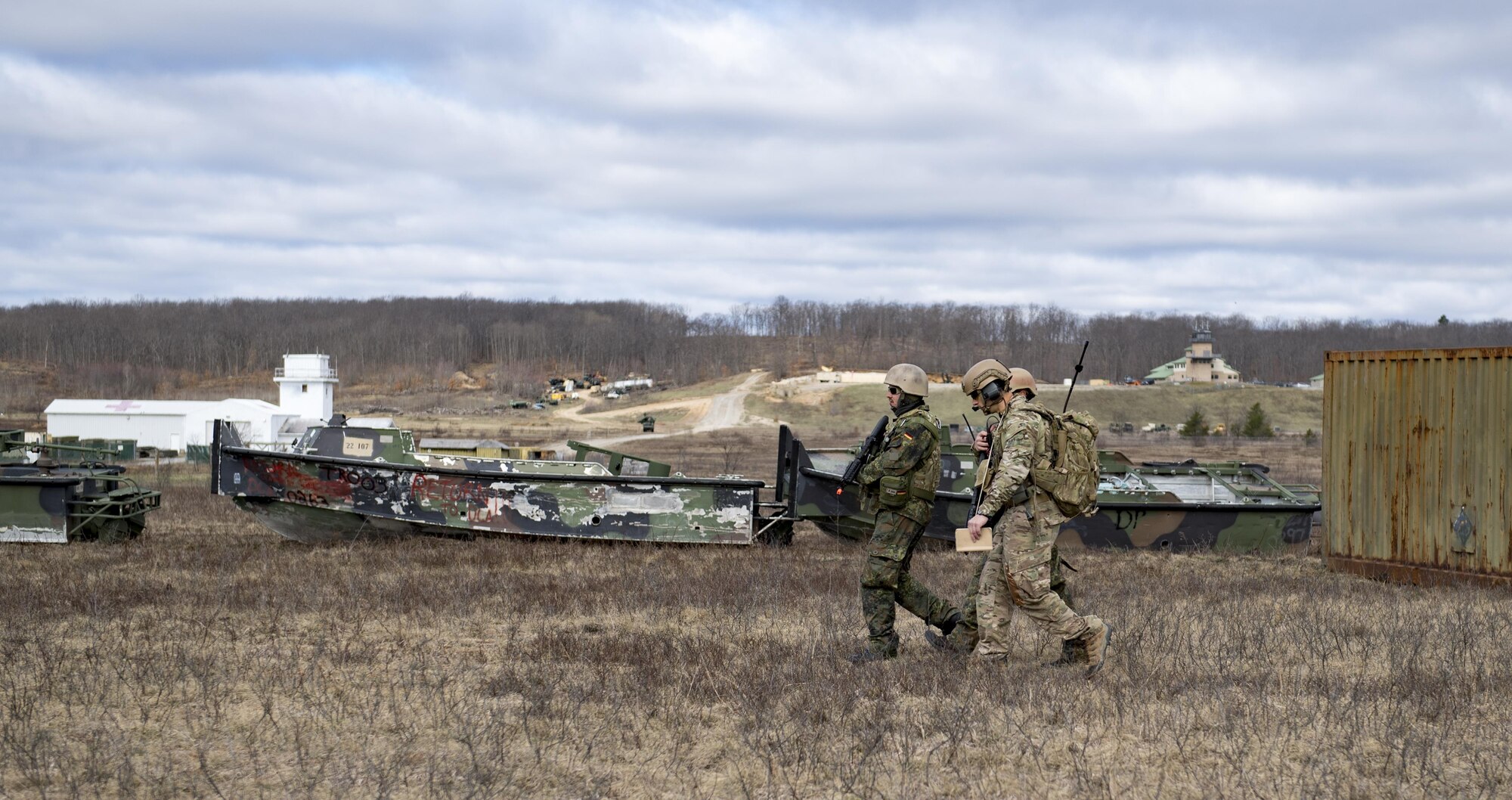 Airmen from the 19th Air Support Operations Squadron and the German air force travel across Camp Grayling, Mich., during a close air support exercise, April 12, 2017. To further build interoperability and hone their unique skillset, members of the German air force Air Ground Operations Squadron travelled to the U.S. to partner with the 19th ASOS and conduct a close air support exercise working with A-10C Thunderbolts IIs and F-16 Fighting Falcons. (U.S. Air Force photo by Airman 1st Class Daniel Snider)