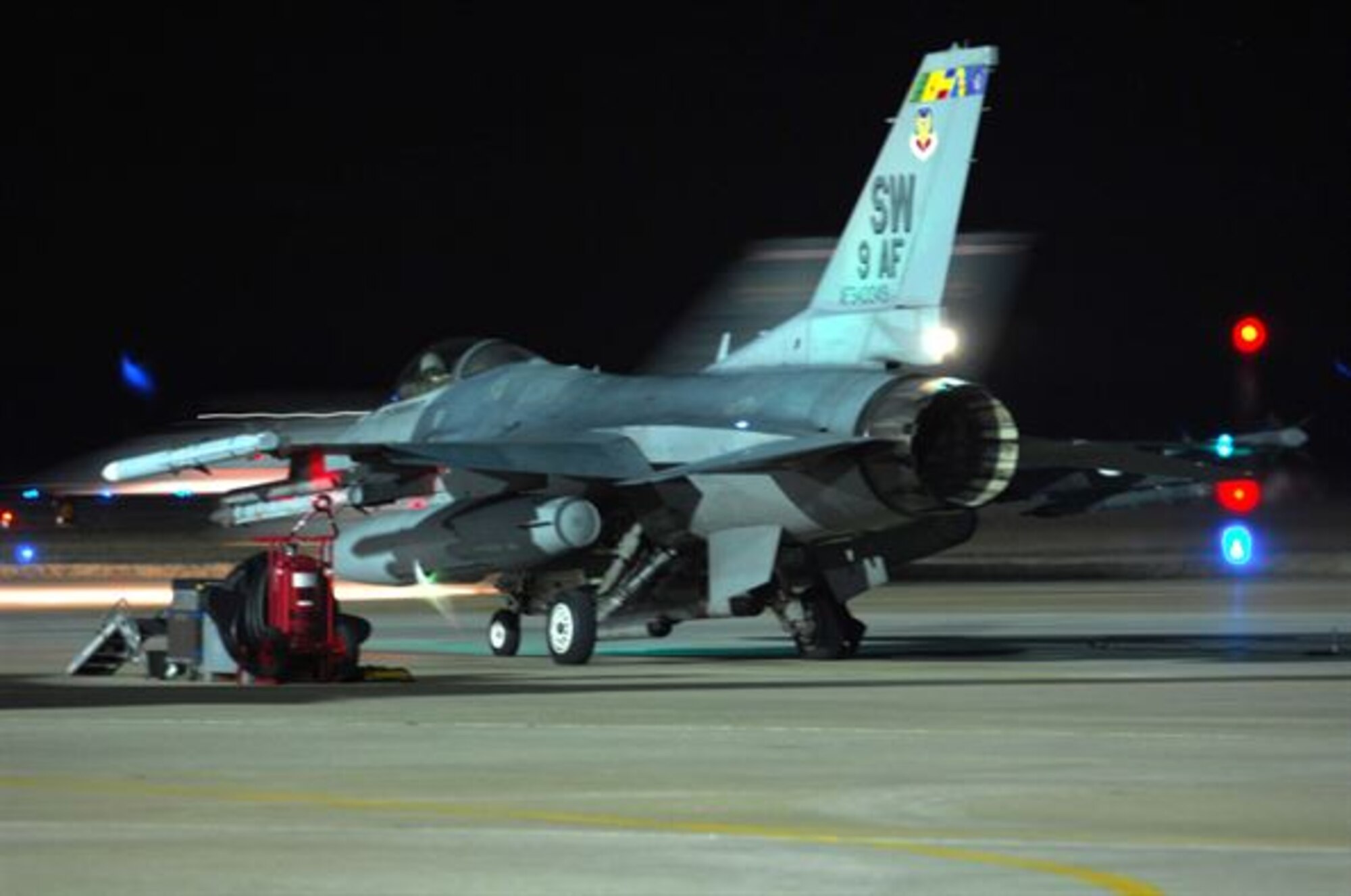 A U.S. Air Force pilot assigned to the 55th Fighter Squadron prepares for night training in a F-16CM Fighting Falcon at Shaw Air Force Base, S.C., Jan. 15, 2008. Night flying prepares pilots and ground crew members for tasks they may face during real combat operations while deployed. (U.S. Air Force photo by Airman 1st Class William Coleman)