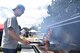 U.S. Air Force Senior Master Sgt. David Clark, 17th Training Wing first sergeant, cooks burgers during sports day near the Mathis Fitness Center on Goodfellow Air Force Base, Texas, April 14, 2017. The Top 3 supported the 17th Force Support Squadron’s burger burn by providing volunteers to cook and monitor food. (U.S. Air Force photo by Staff Sgt. Joshua Edwards/Released)
