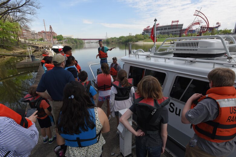 Civil Engineers Noel Smith and Cody Flatt talk about hydrographic surveying with kids who boarded the district’s navigation survey boat as part of the district’s “Take Your Kids to Work Day” activities at Riverfront in Nashville, Tenn., April 14, 2017.